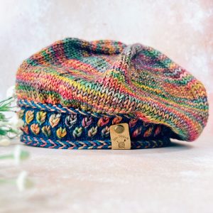 A New Leaf Beret Knitting Pattern by Audacious ewe, in autumn coloured worsted weight yarn.